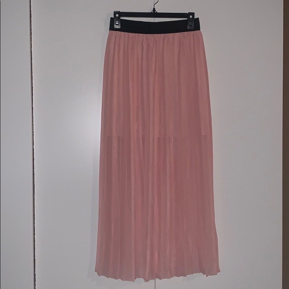 Long peach skirt with a short slip.